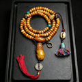 108-Piece Vintage Bone Flat Round Bead Long Necklace with Hand Carved Figurine Pendant & Handwoven