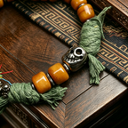 Handwoven Himalayan Style Beaded Bracelet with Vintage Metal Charm