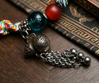 Handwoven Himalayan Style Beaded Bracelet with Vintage Metal Charm
