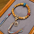 Hand Carved Natural Bone & Herbal Seed Bead Bracelet with Tassel Pendant | Himalayan Ethnic Handcrafted Wrist Jewelry for Grounding Energy & Inner Peace
