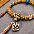 Hand Carved Natural Bone & Herbal Seed Bead Bracelet with Tassel Pendant | Himalayan Ethnic Handcrafted Wrist Jewelry for Grounding Energy & Inner Peace